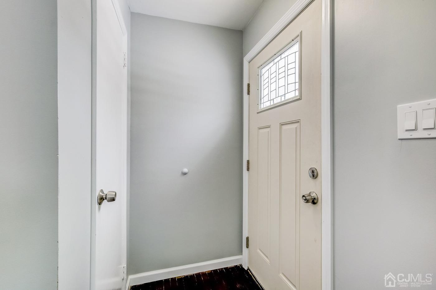 59 Stony Road Edison, NJ 08817 - Photo 3 of 27 a view of front door with wooden floor