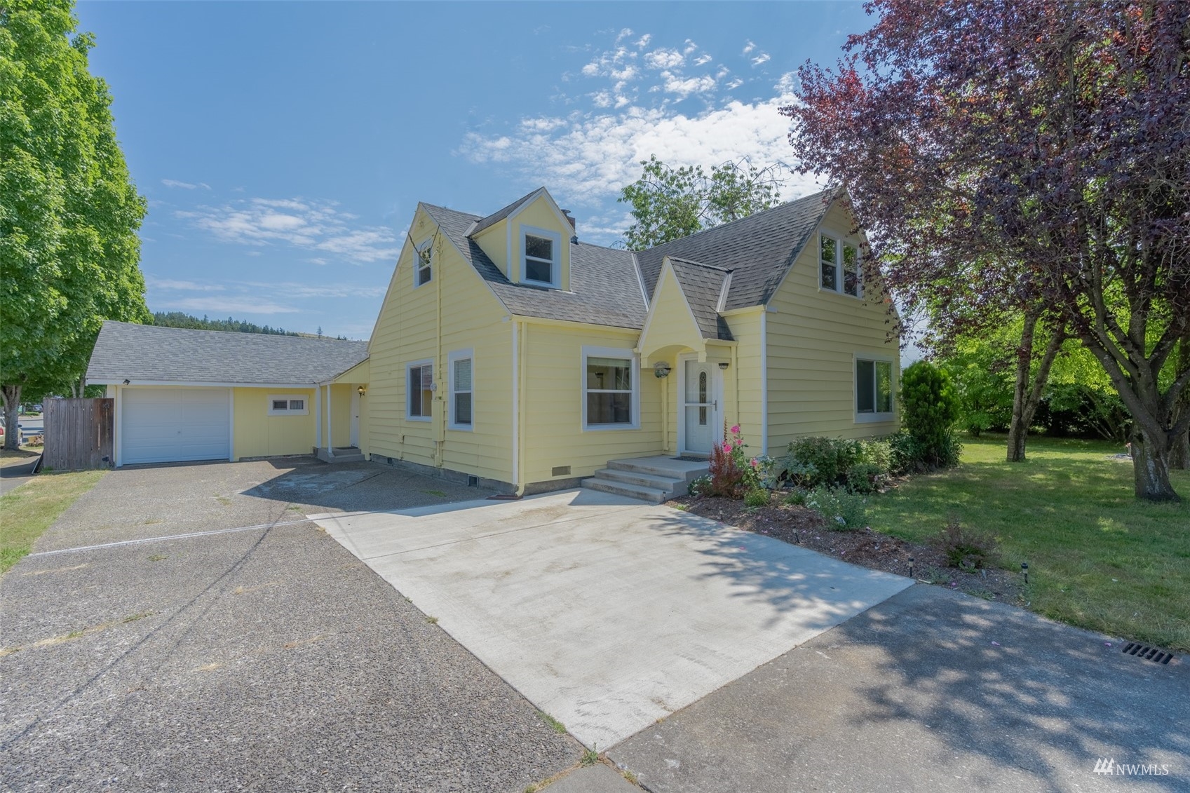 5415 Parker Road East Sumner, WA 98390 - Photo 1 of 27 a view of a house with a yard and potted plants