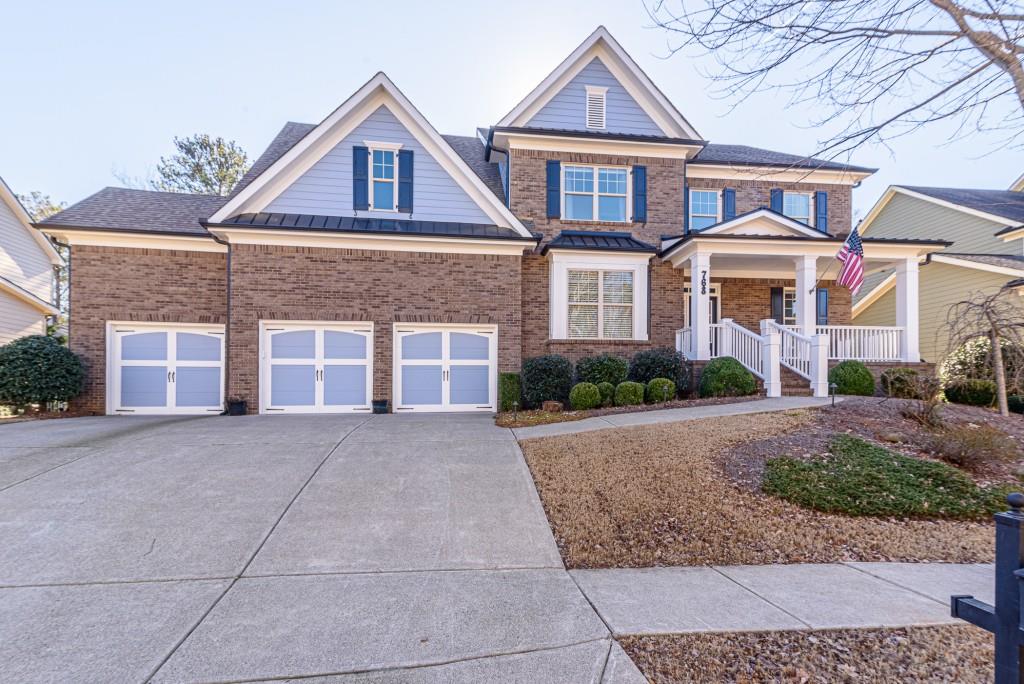768 Crescent Circle Canton, GA 30115 - Photo 1 of 1 front view of a brick house with a yard