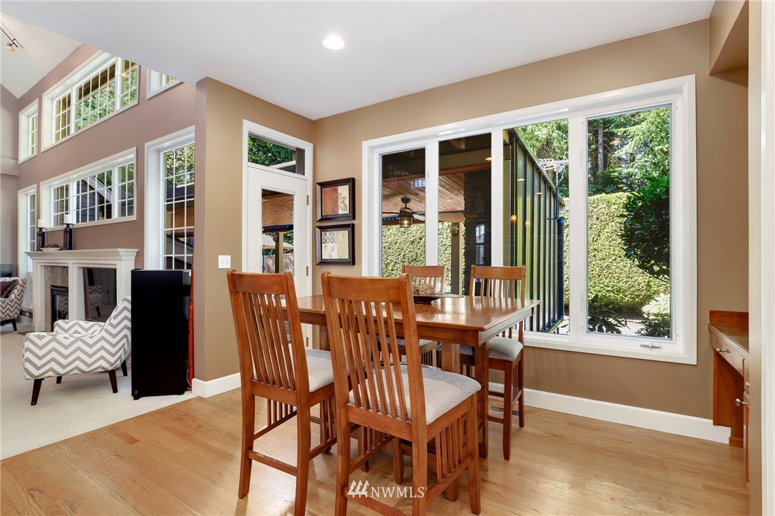 20710 35th Drive Southeast Bothell, WA 98021 - Photo 14 of 40 a view of a dining room with furniture large windows and wooden floor
