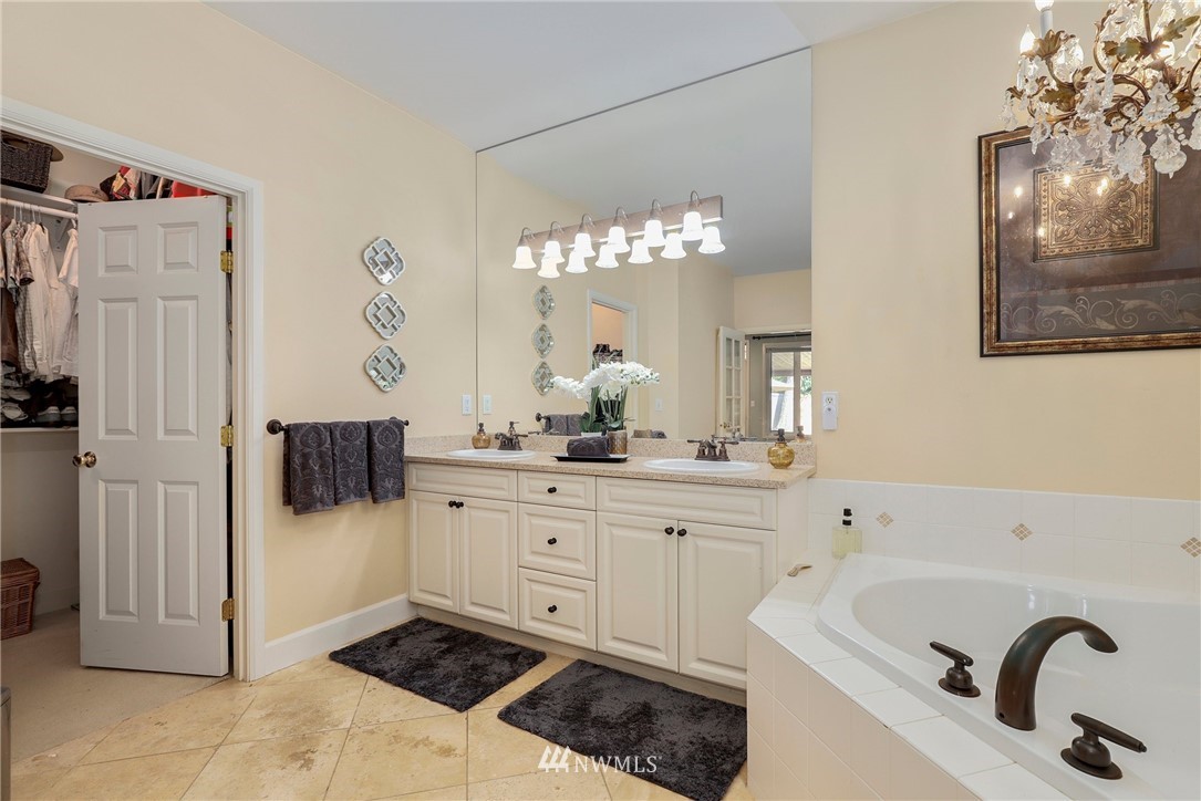 20710 35th Drive Southeast Bothell, WA 98021 - Photo 22 of 40 a spacious bathroom with a sink and a mirror