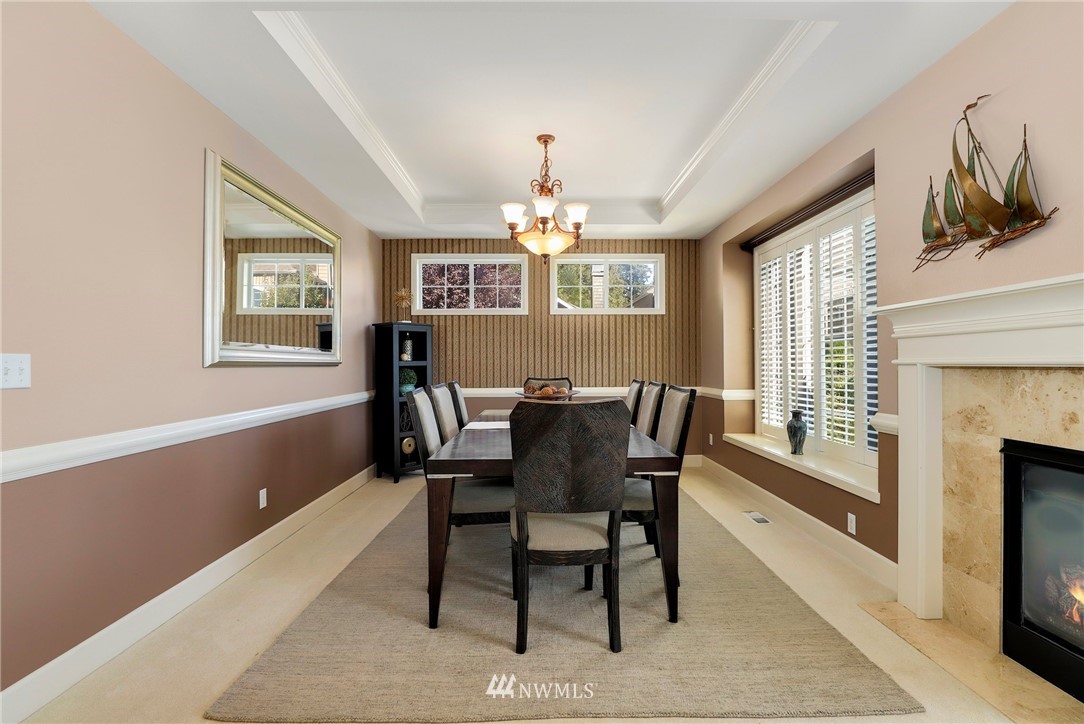 20710 35th Drive Southeast Bothell, WA 98021 - Photo 8 of 40 a dining room with furniture a chandelier and wooden floor