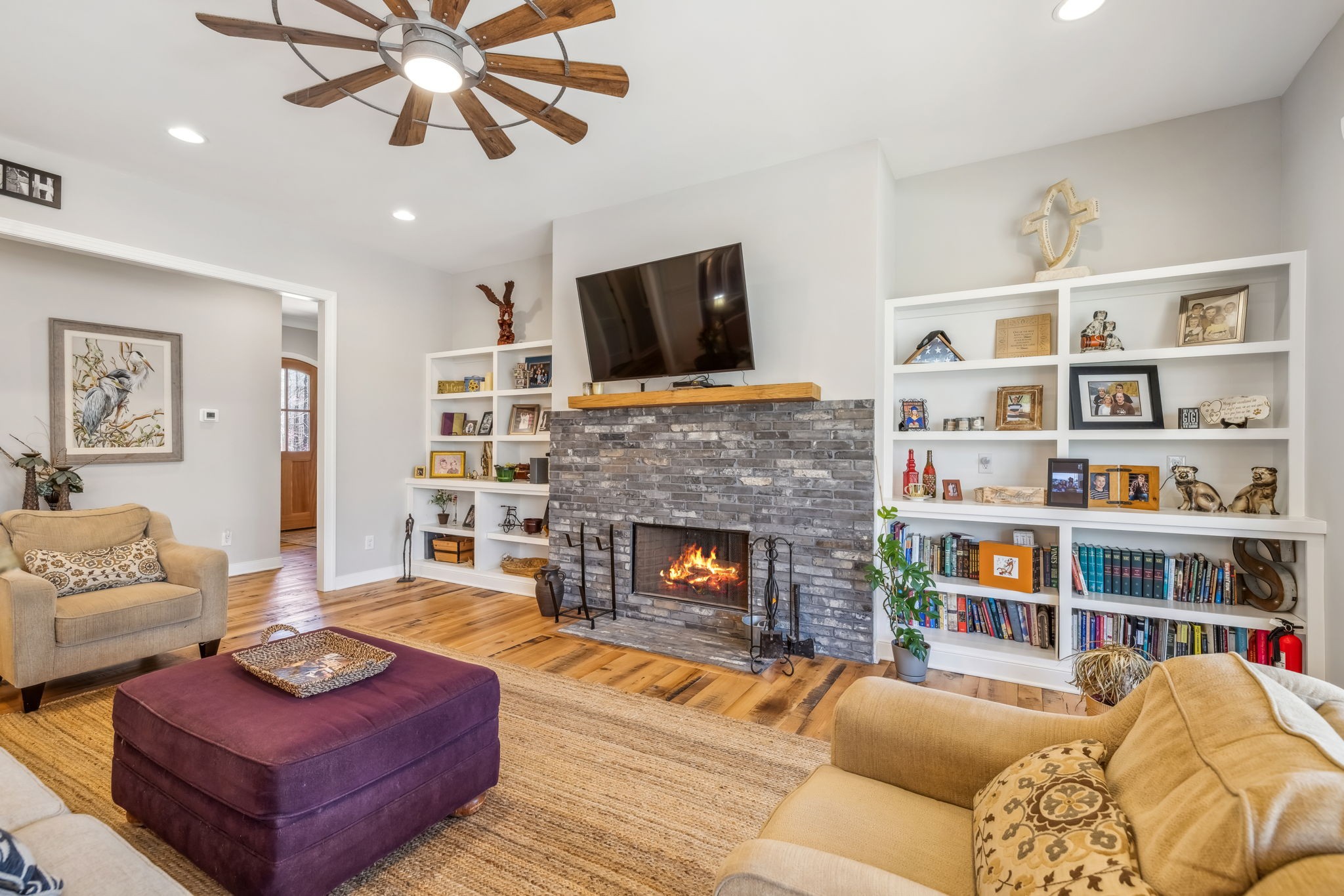 6033 Vesper Way Franklin, TN 37064 - Photo 17 of 83 a living room with furniture and a fireplace