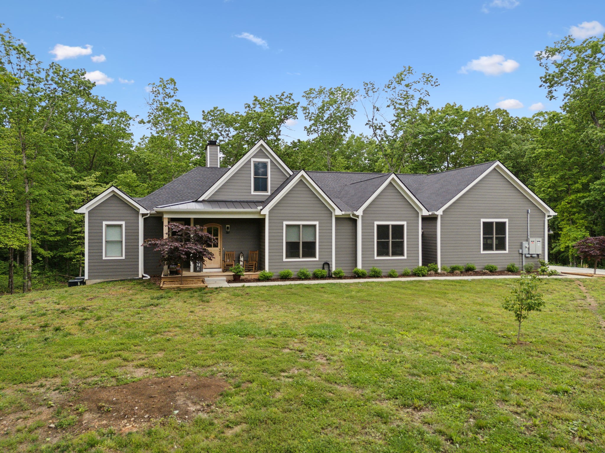6033 Vesper Way Franklin, TN 37064 - Photo 4 of 83 a front view of a house with yard porch and outdoor seating
