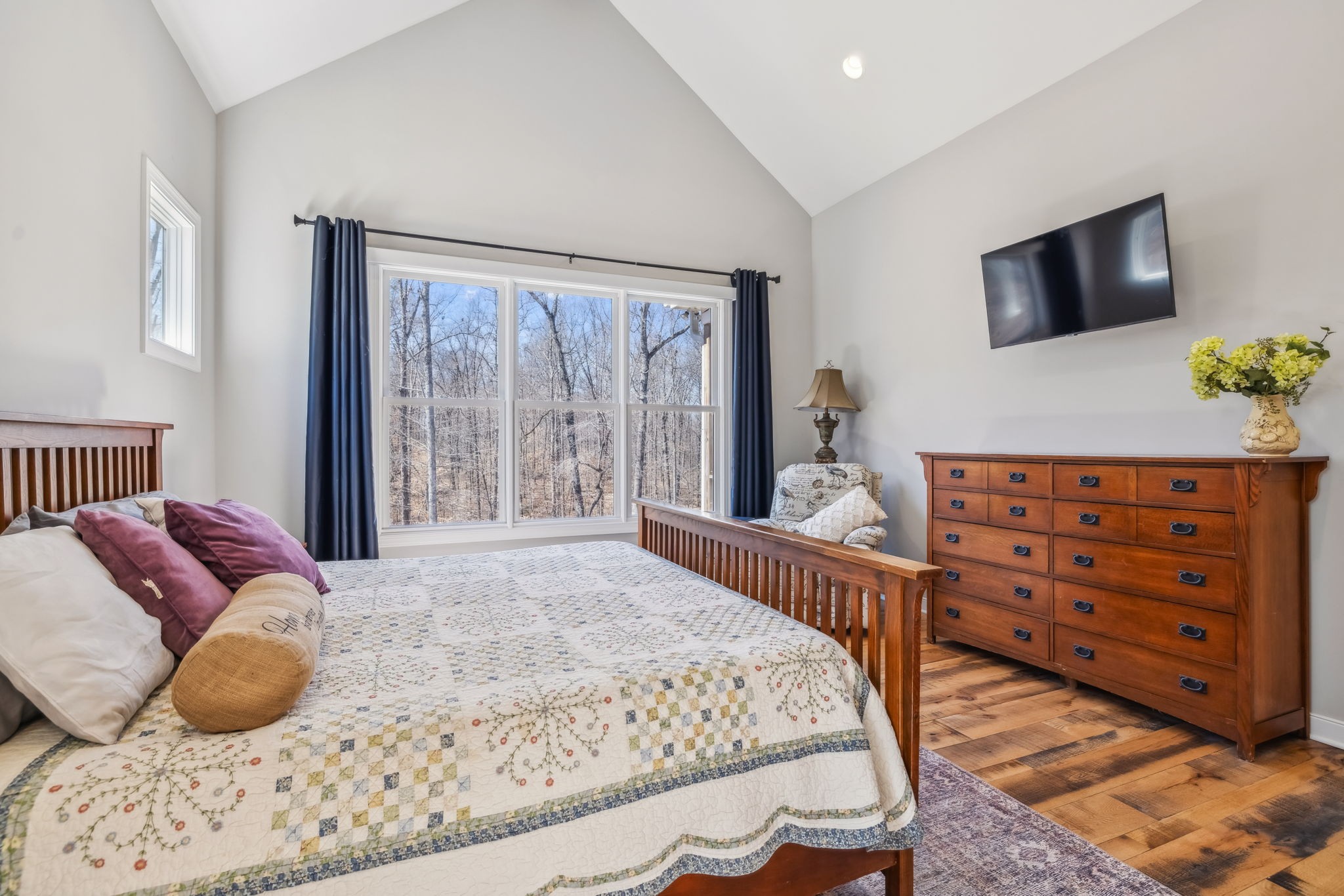 6033 Vesper Way Franklin, TN 37064 - Photo 43 of 83 a bedroom with a bed and flat screen tv