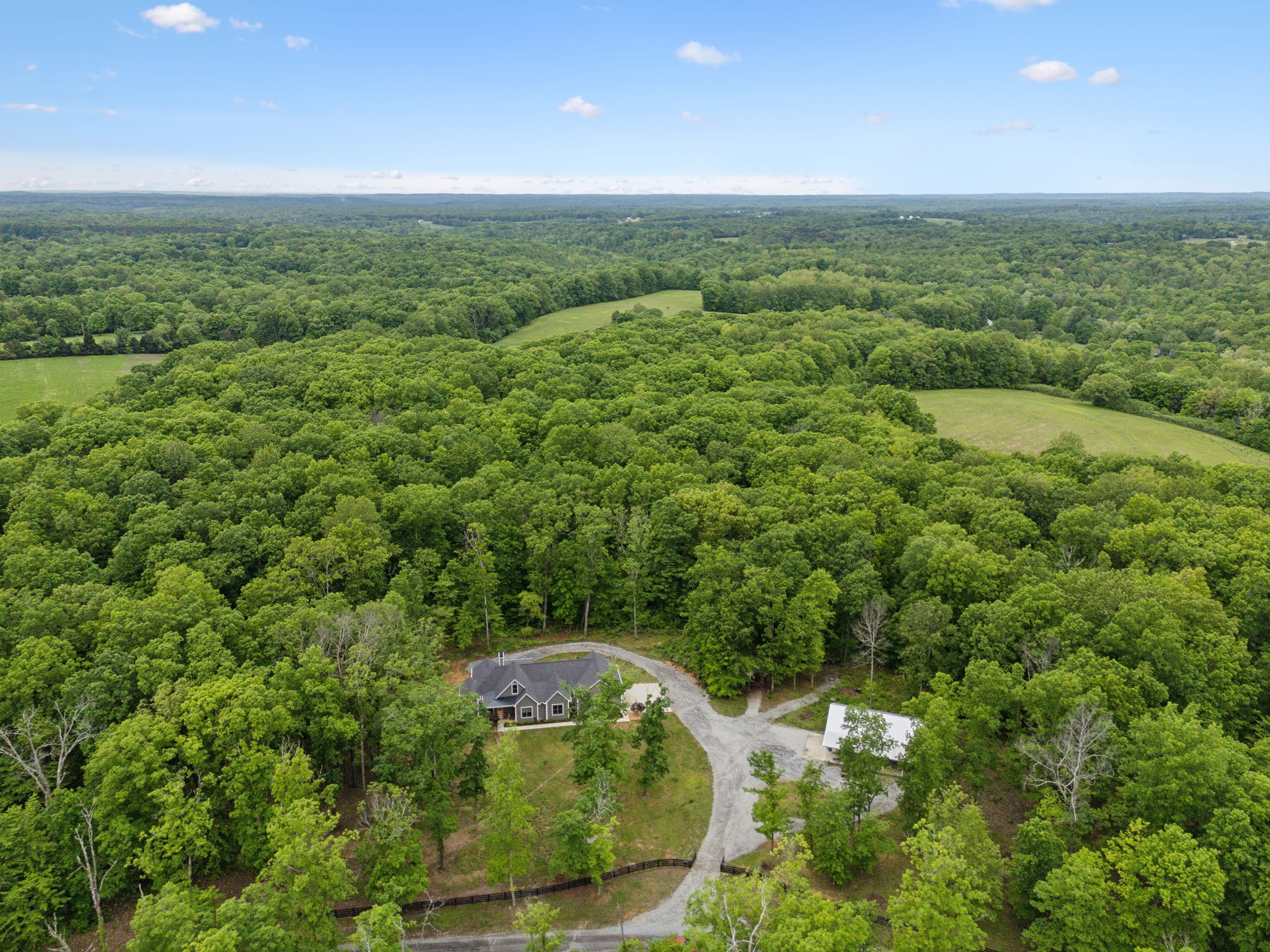 6033 Vesper Way Franklin, TN 37064 - Photo 8 of 83 a view of a city with lush green forest