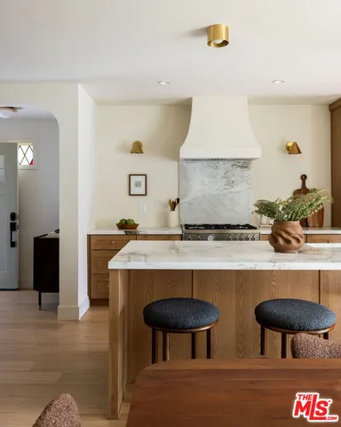 a kitchen with a table and chairs