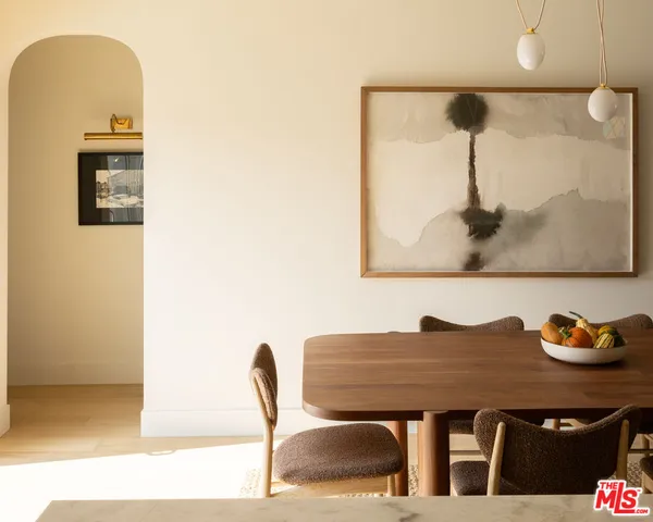 a dining room with a table and chairs