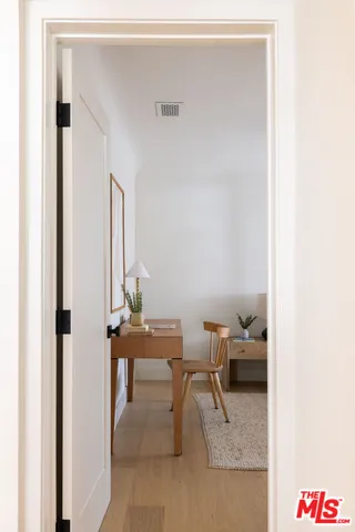 a reading room with furniture and a lamp