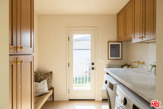 a en suite bathroom with a granite countertop sink and a mirror