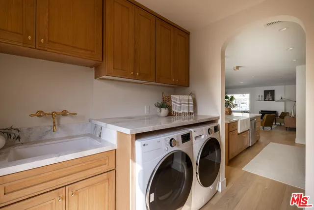 a view of a kitchen with sink and cabinets