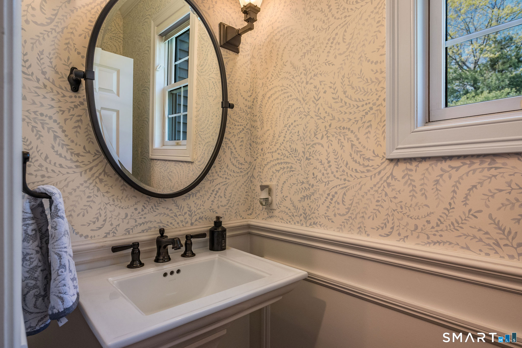 170 Devonshire Lane Madison, CT 06443 - Photo 17 of 39 a bathroom with a sink and a mirror