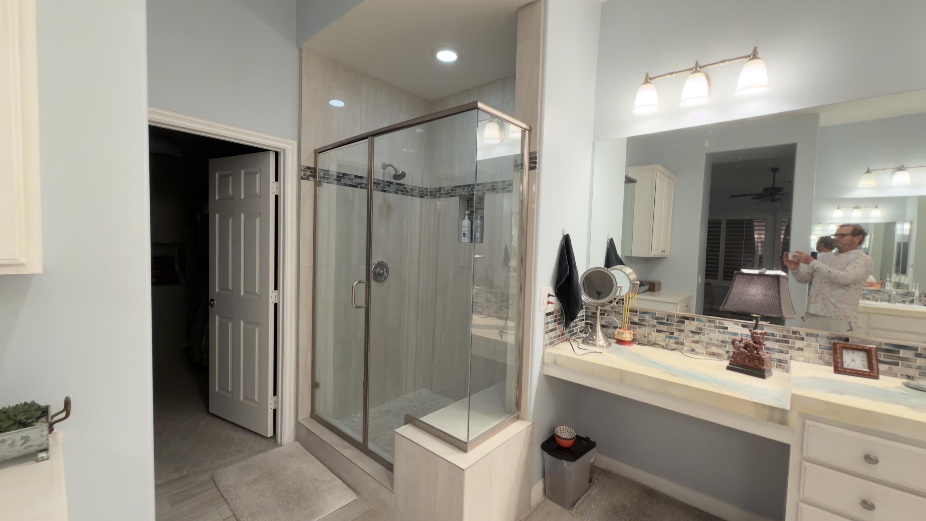 49578 Colorado Street Indio, CA 92201 - Photo 19 of 37 a bathroom with a shower sink and mirror