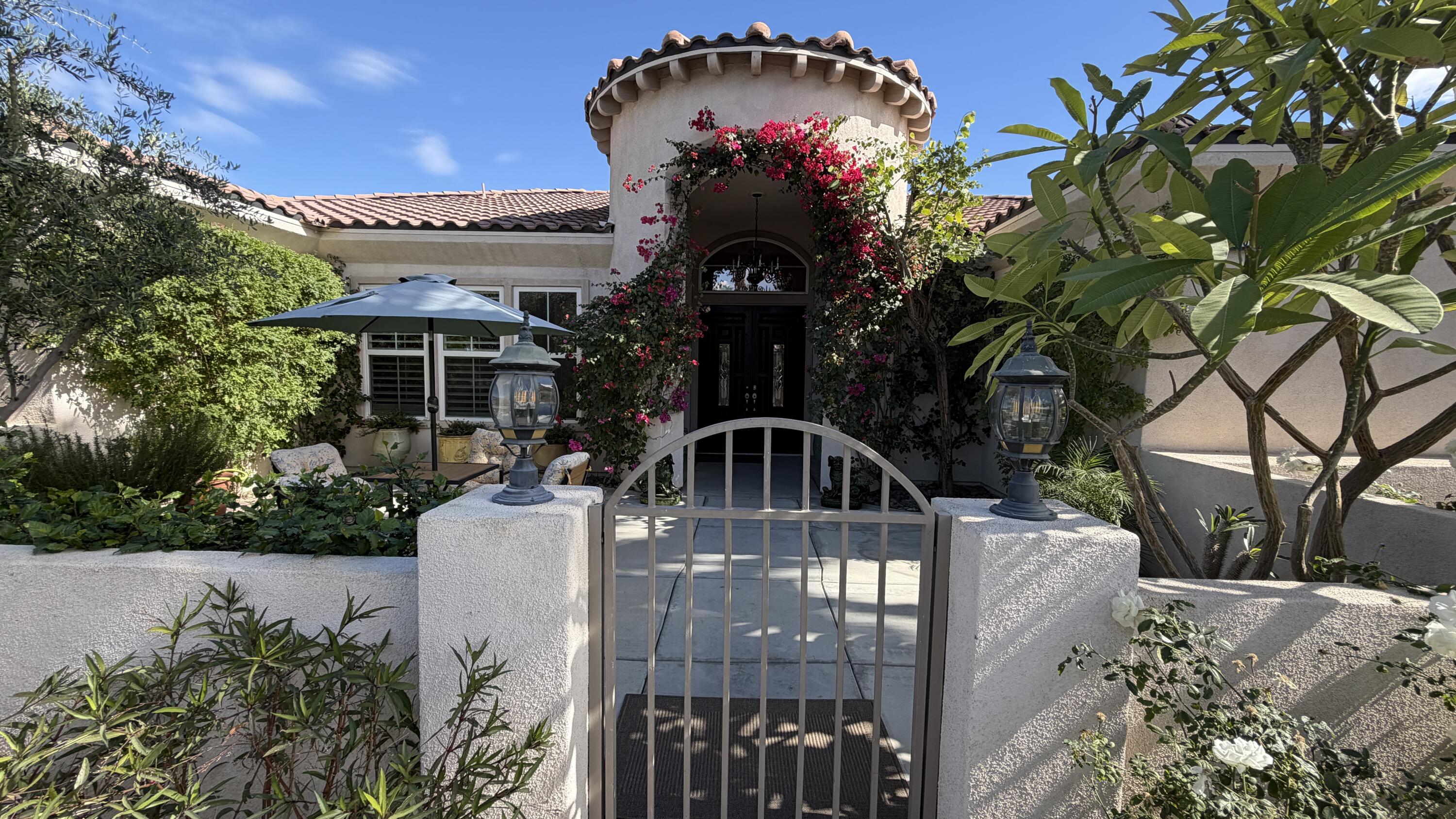 49578 Colorado Street Indio, CA 92201 - Photo 3 of 37 a front view of a house with a yard