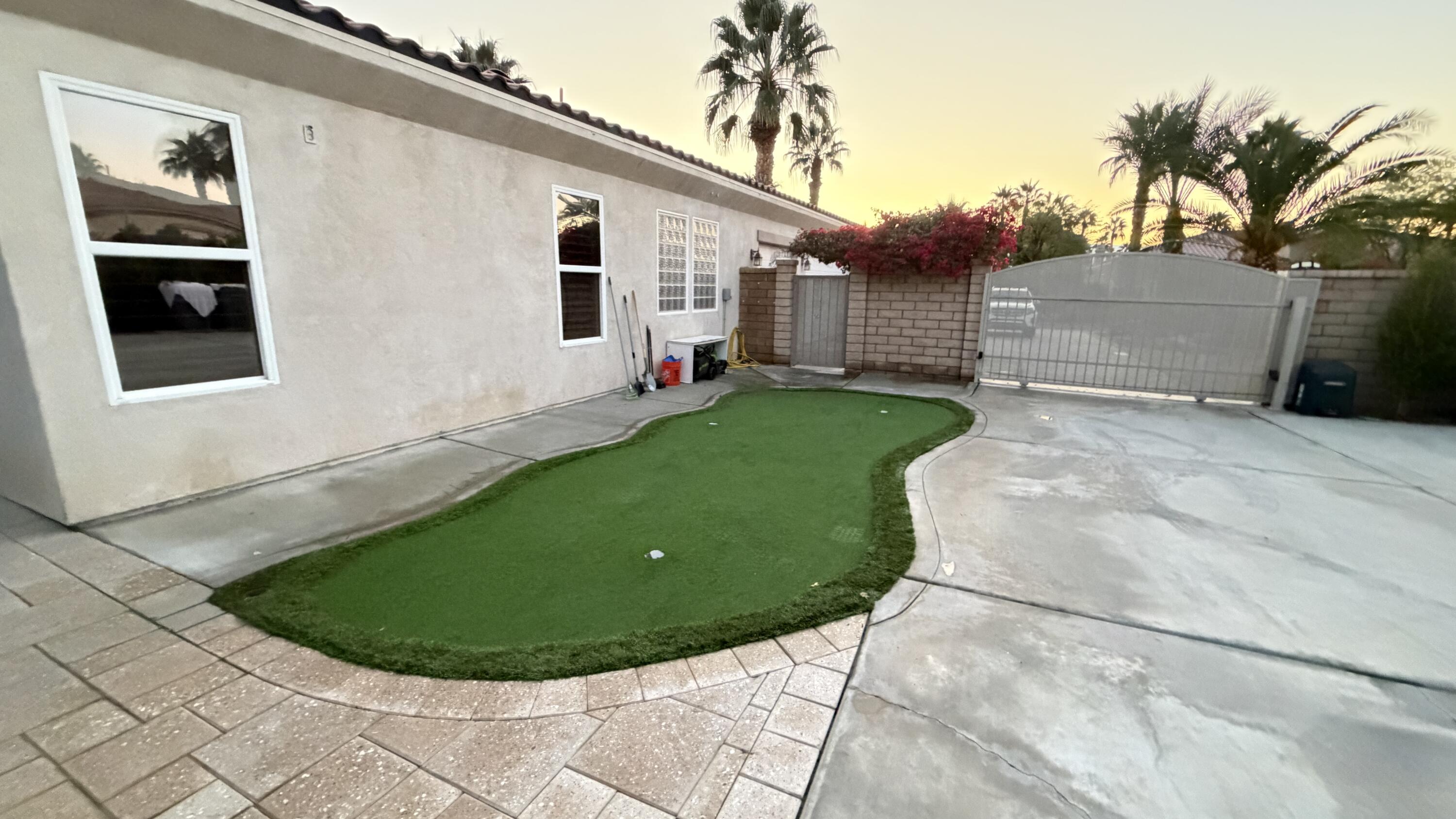 49578 Colorado Street Indio, CA 92201 - Photo 33 of 37 a view of a backyard with potted plants