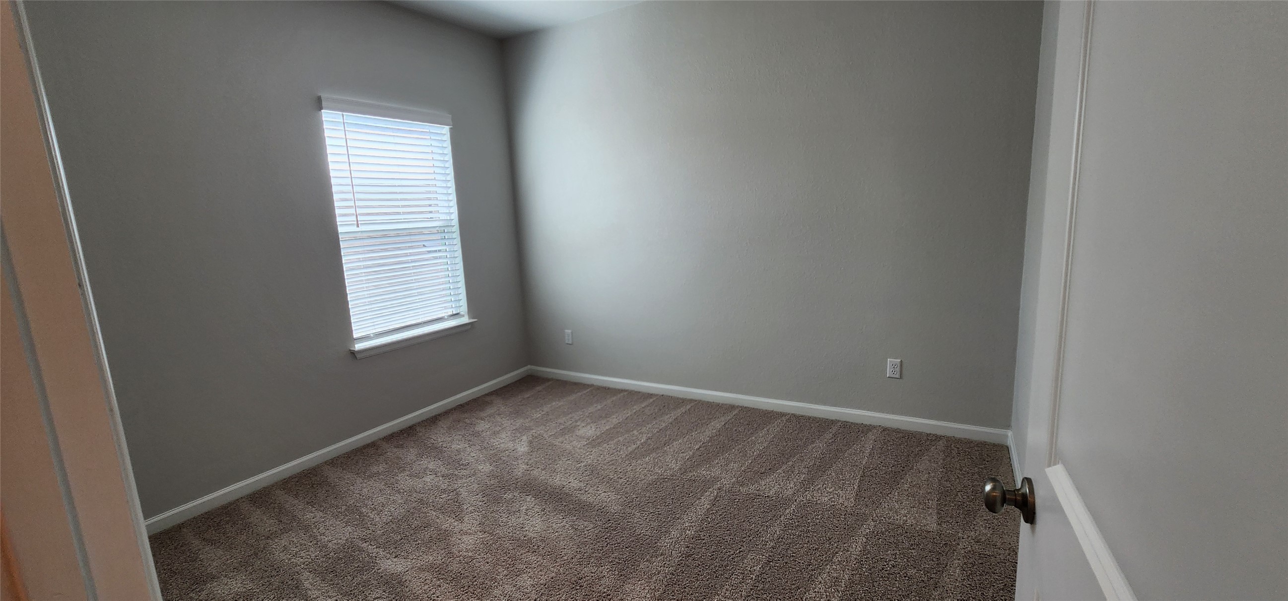 148 Los Olives Lane Georgetown, TX 78628 - Photo 30 of 38 Spare room featuring baseboards and carpet flooring