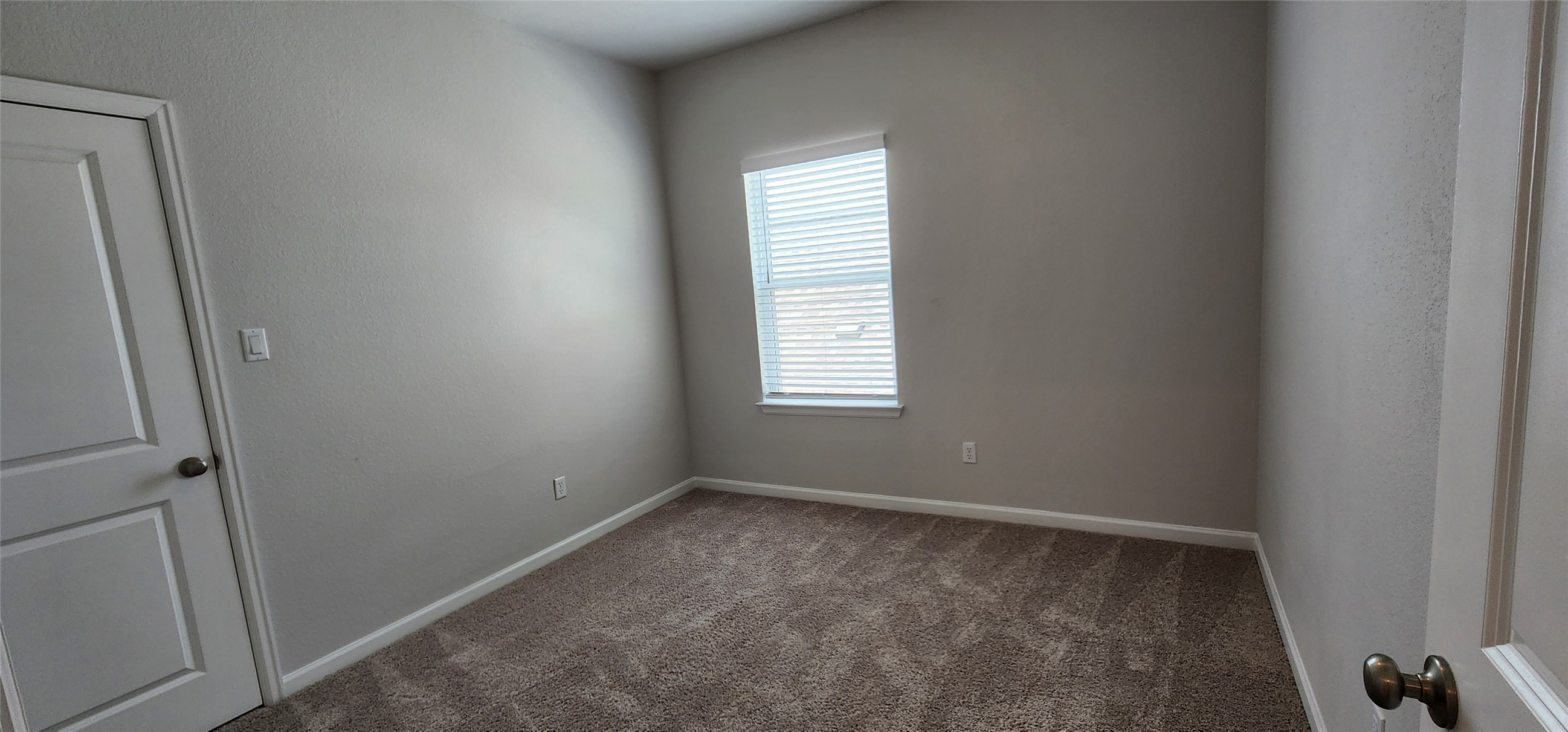 148 Los Olives Lane Georgetown, TX 78628 - Photo 34 of 38 Spare room featuring carpet and baseboards