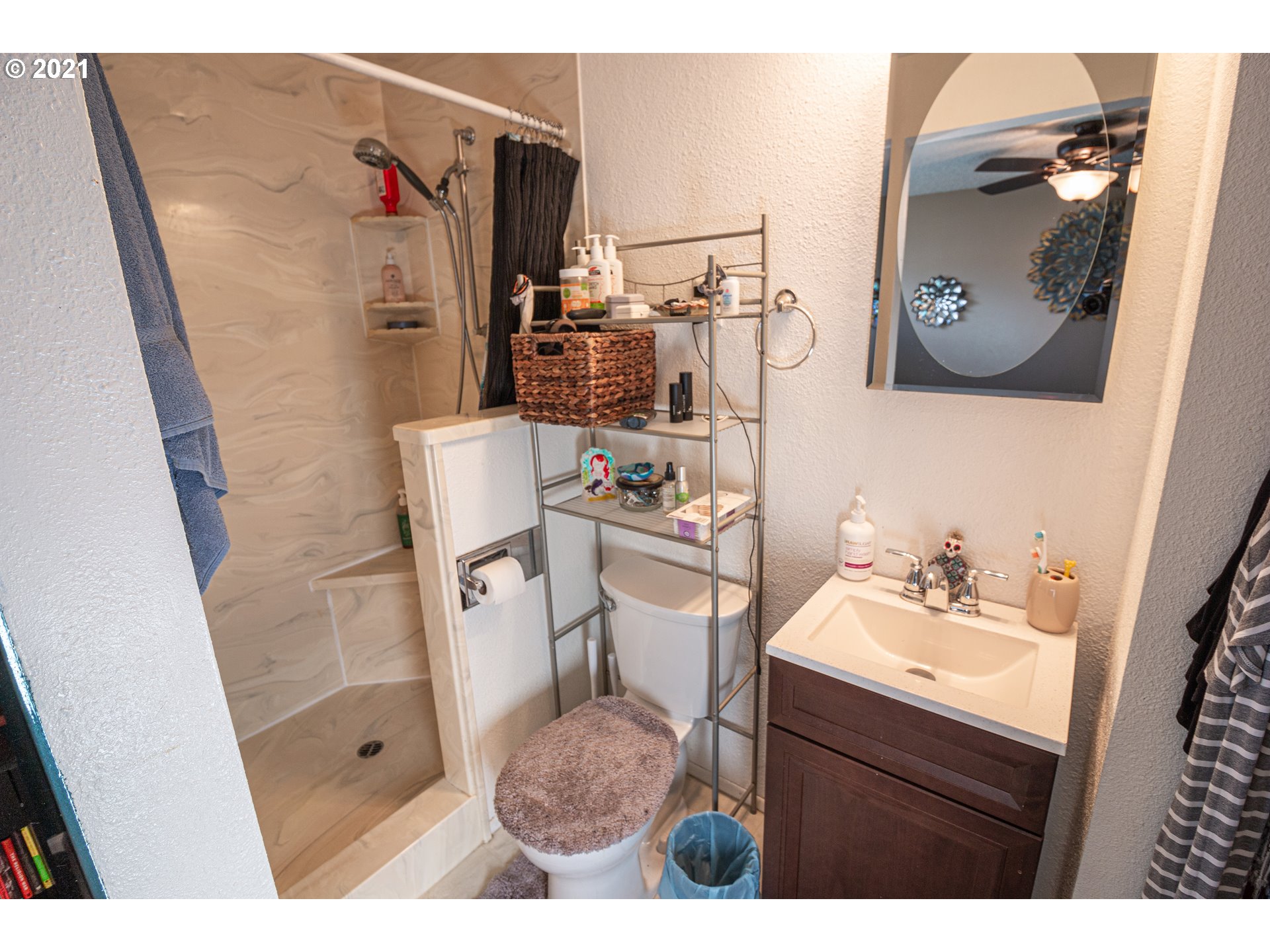 5206 F Street Springfield, OR 97478 - Photo 11 of 17 a bathroom with a sink vanity toilet and shower