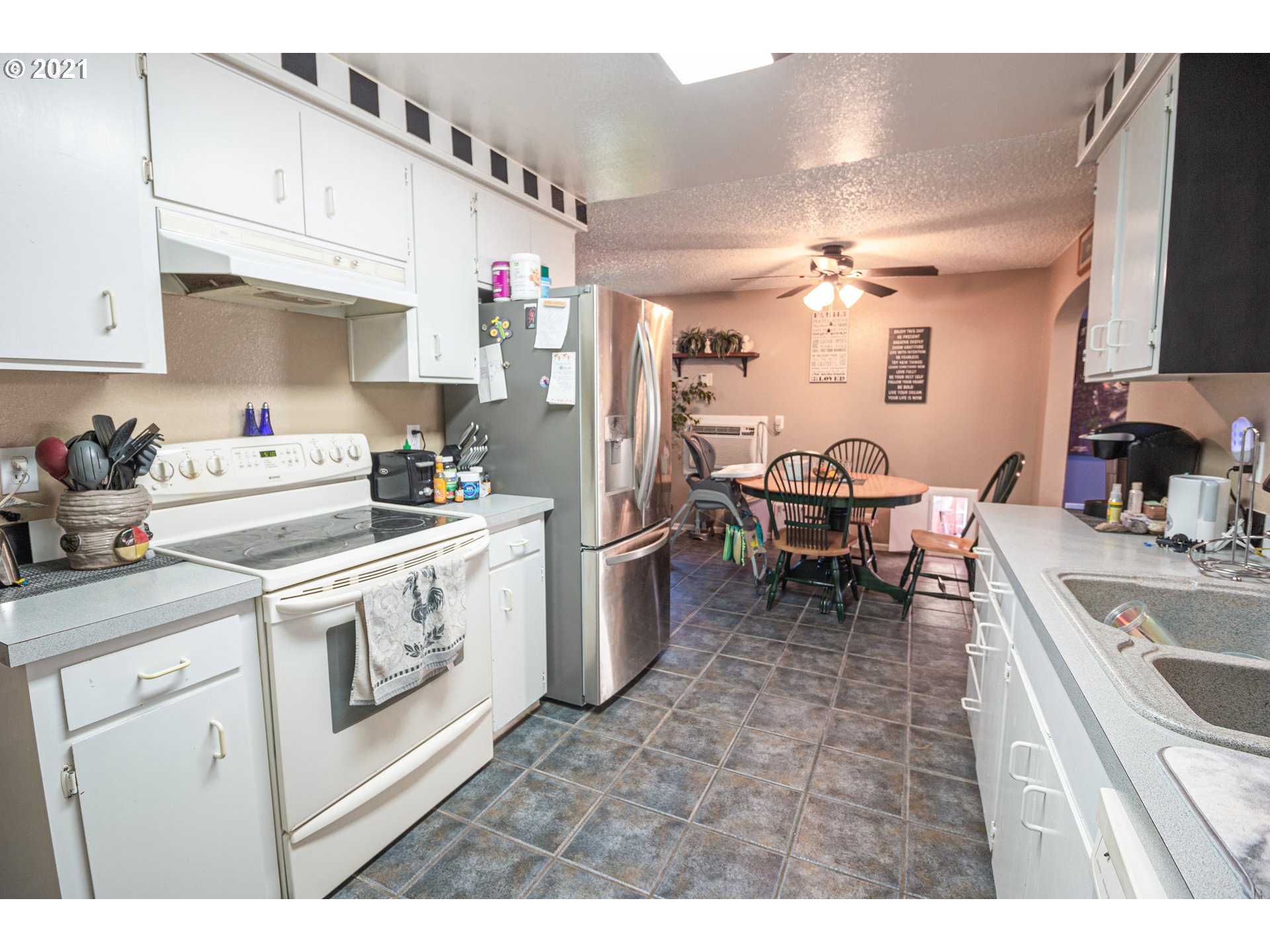 5206 F Street Springfield, OR 97478 - Photo 9 of 17 a kitchen that has a lot of cabinets in it and appliances