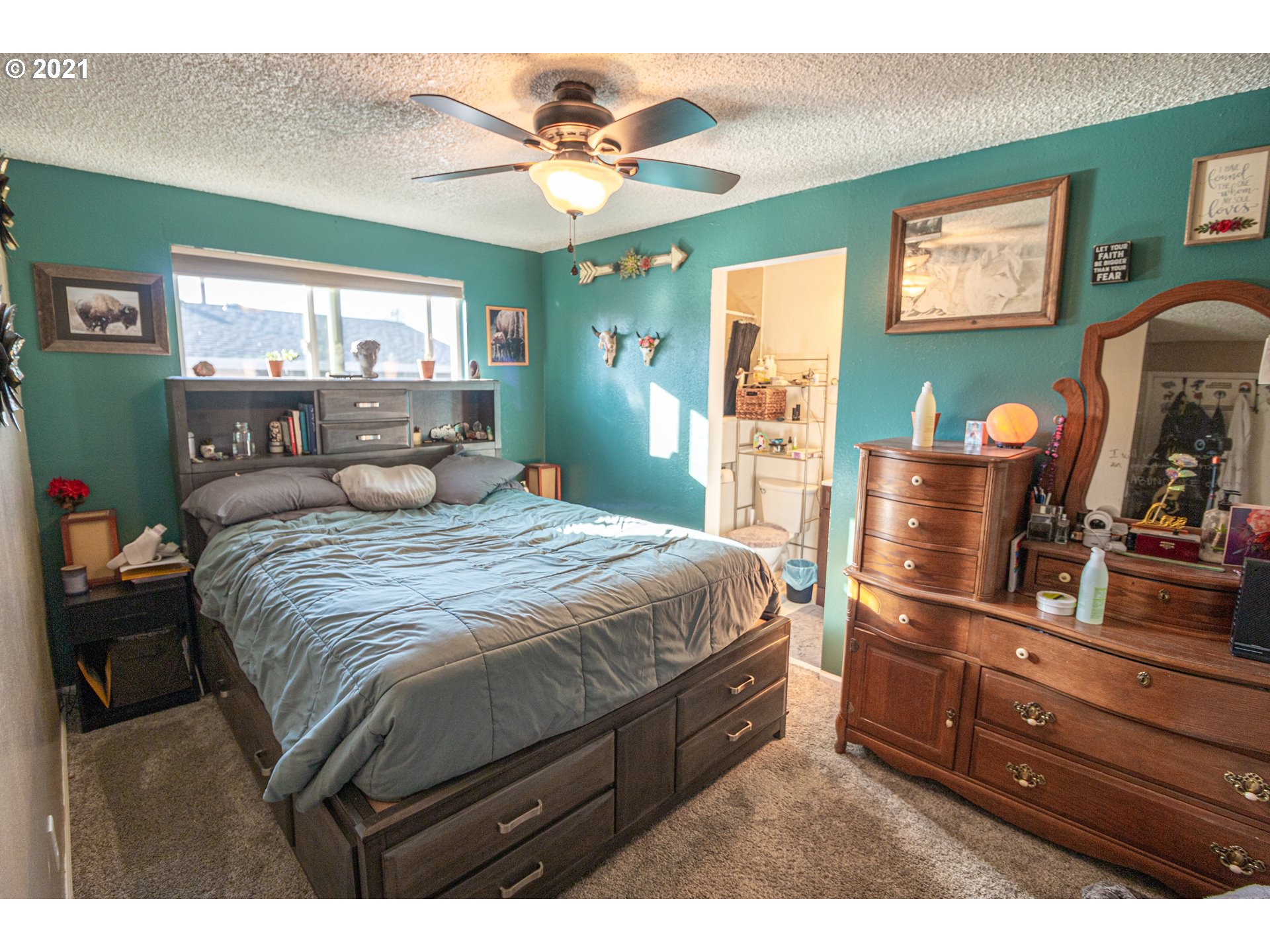 5206 F Street Springfield, OR 97478 - Photo 10 of 17 a bedroom with a bed and wooden floor