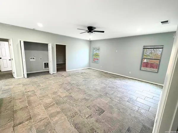 a view of an empty room with a window