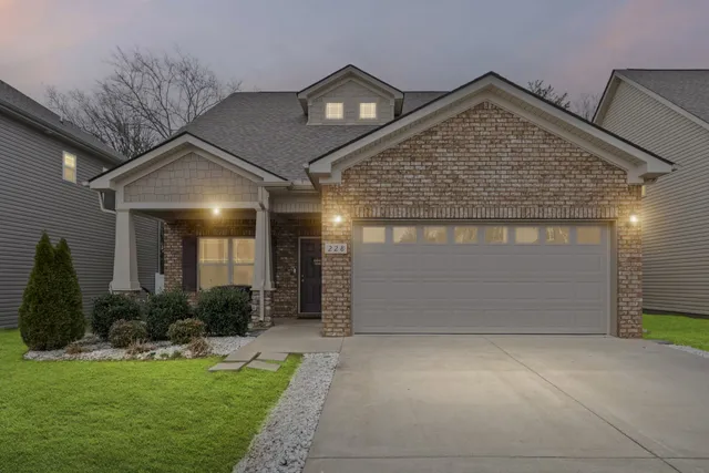 a front view of house with yard and outdoor seating