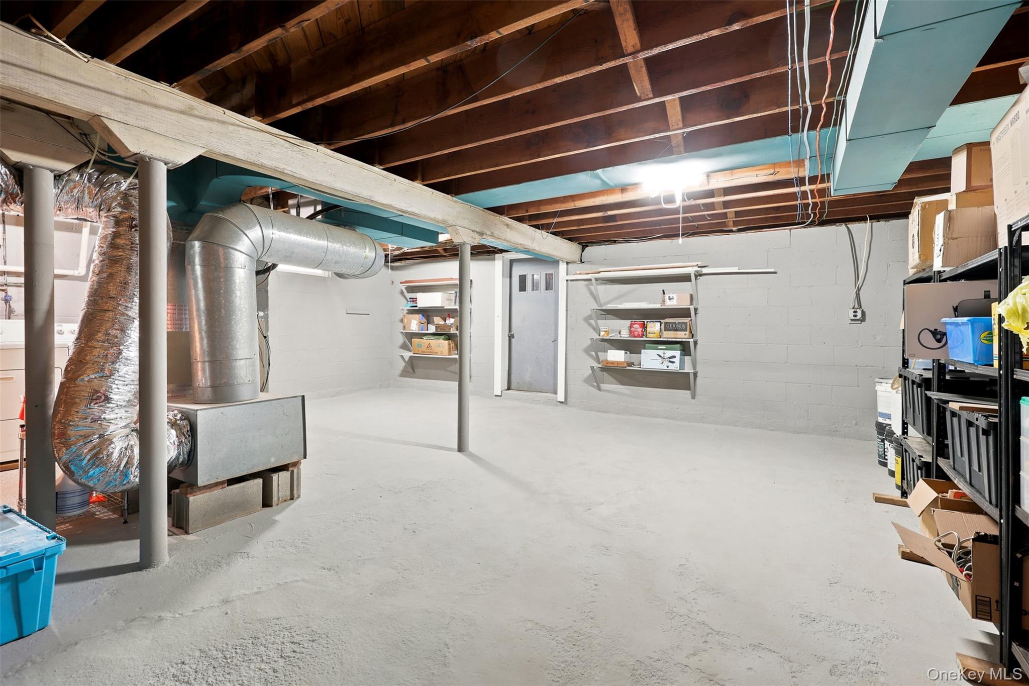 48 Ryerson Road New Hampton, NY 10958 - Photo 25 of 33 Unfinished basement featuring exposed wood ceiling joists and concrete flooring
