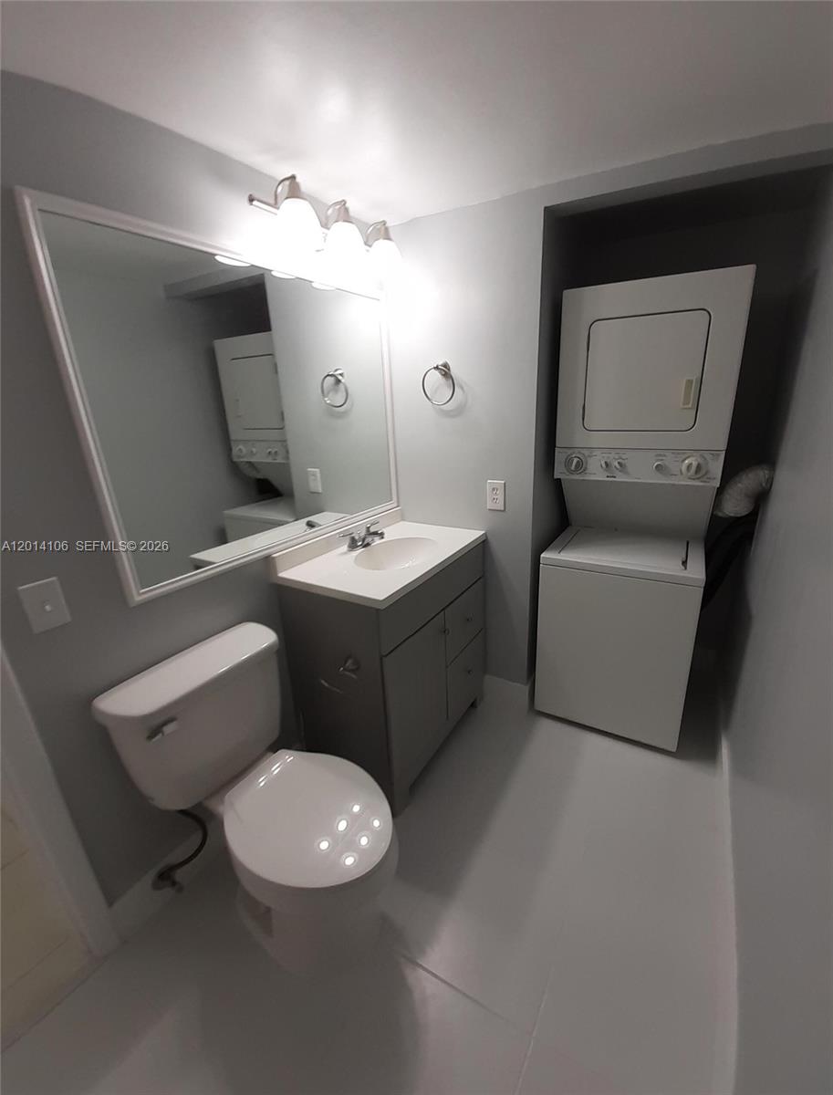 11800 Southwest 18th Street, Unit 3144 Miami, FL 33175 - Photo 14 of 23 a bathroom with a toilet sink and mirror
