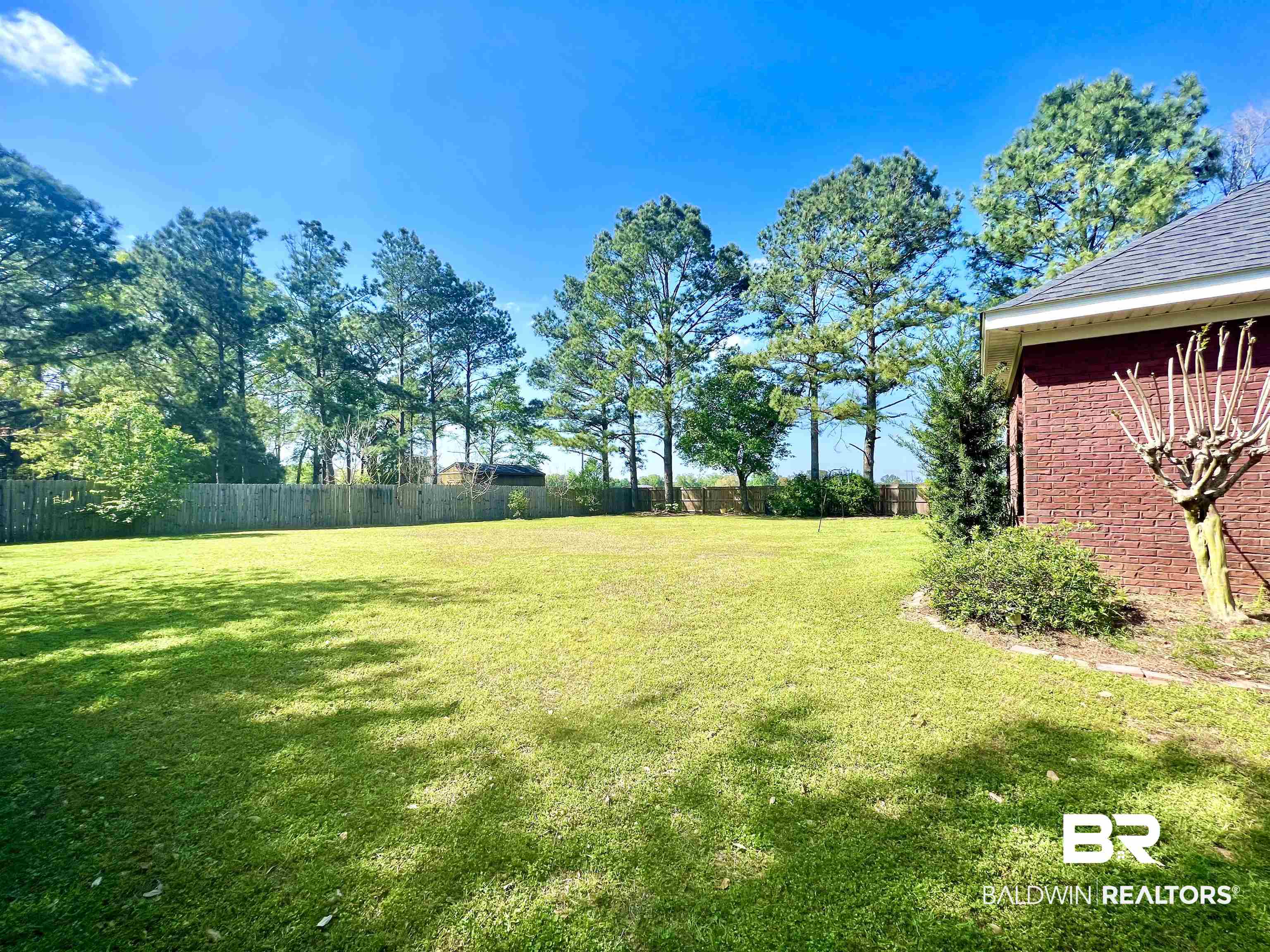 23491 Cornerstone Drive Loxley, AL 36551 - Photo 33 of 38 View from gate. The yard goes beyond that fence!