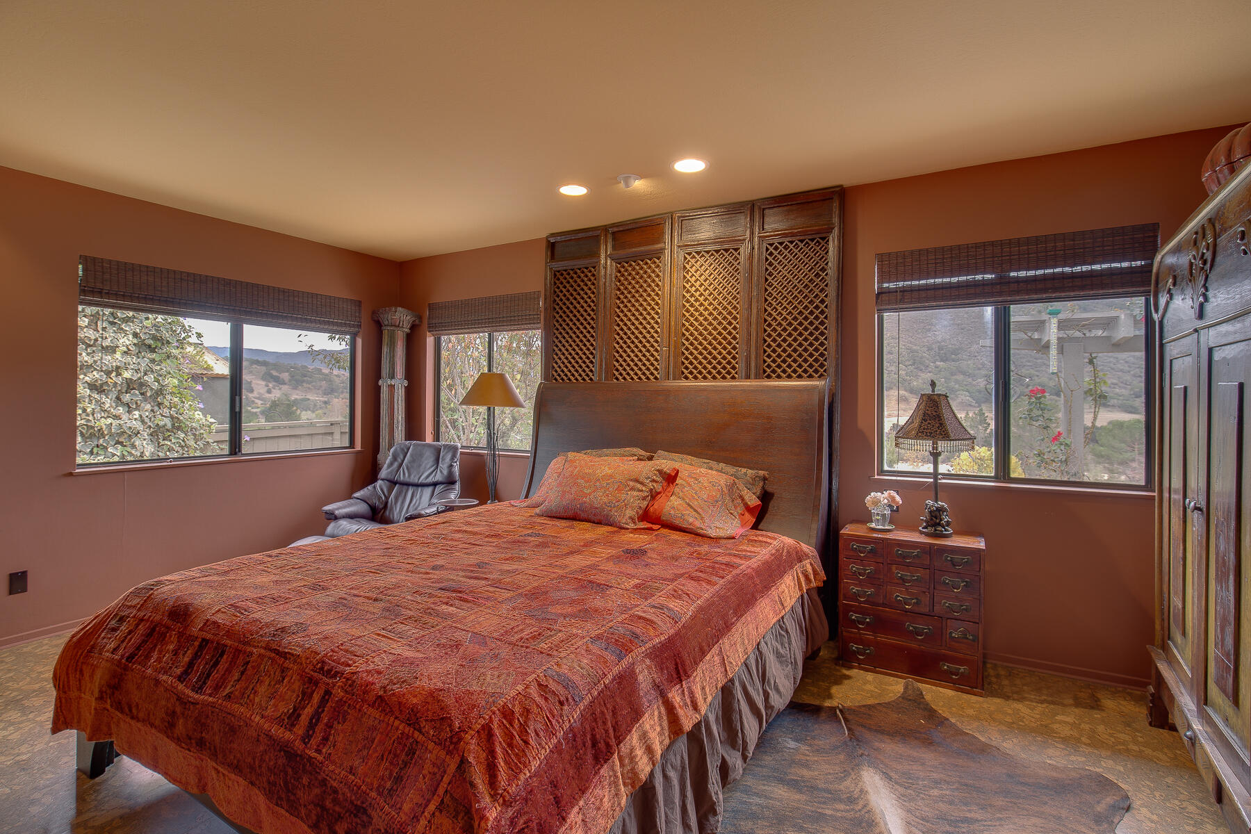137 3rd Street Solvang, CA 93463 - Photo 12 of 24 a bedroom with a bed and wooden floor
