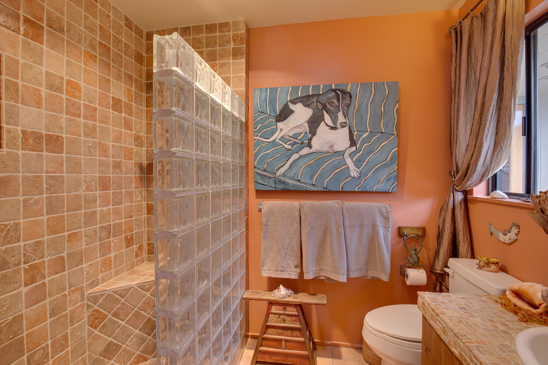 137 3rd Street Solvang, CA 93463 - Photo 15 of 24 a bathroom with a toilet and shower