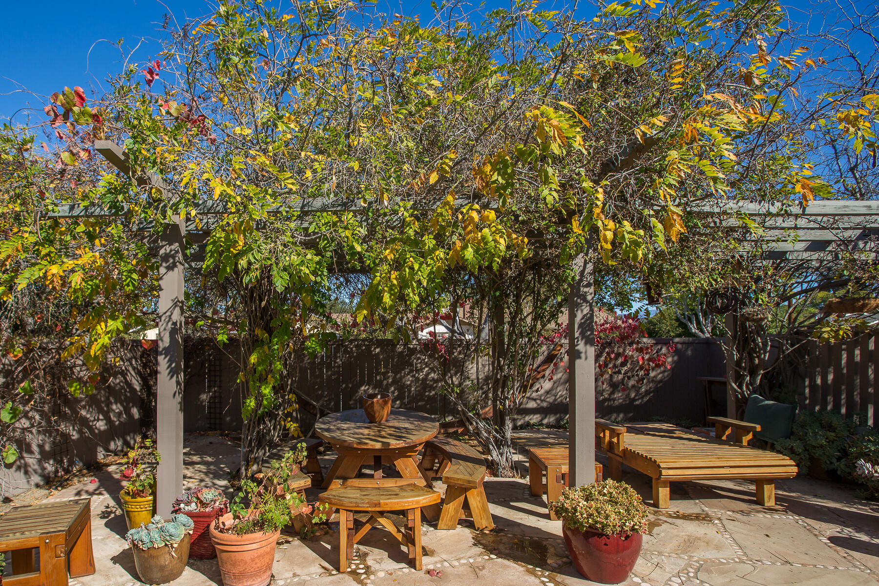 137 3rd Street Solvang, CA 93463 - Photo 22 of 24 a backyard of a house with table and chairs
