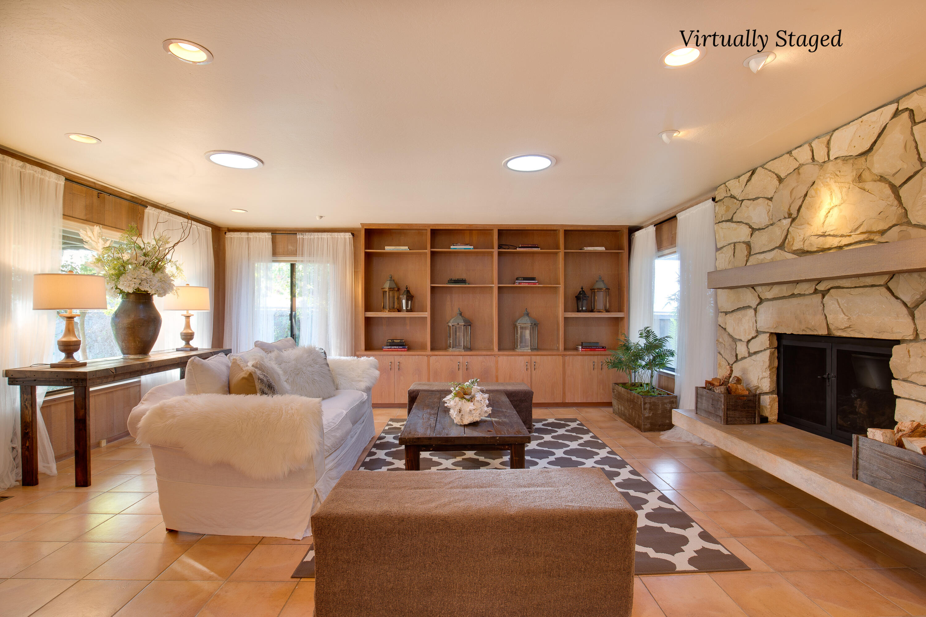 137 3rd Street Solvang, CA 93463 - Photo 5 of 24 a living room with furniture large window and fireplace