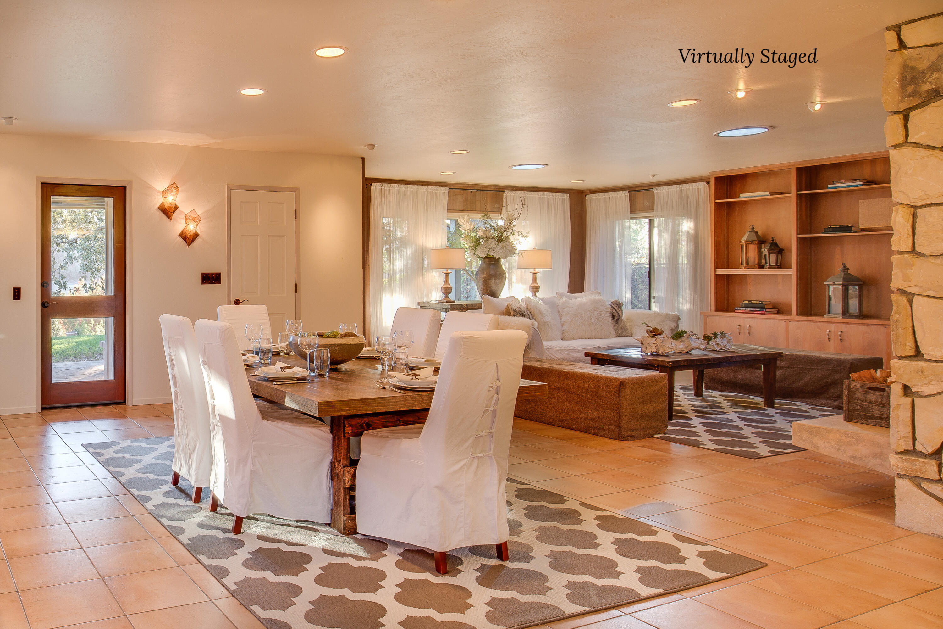 137 3rd Street Solvang, CA 93463 - Photo 7 of 24 a living room with furniture a large window and dining table