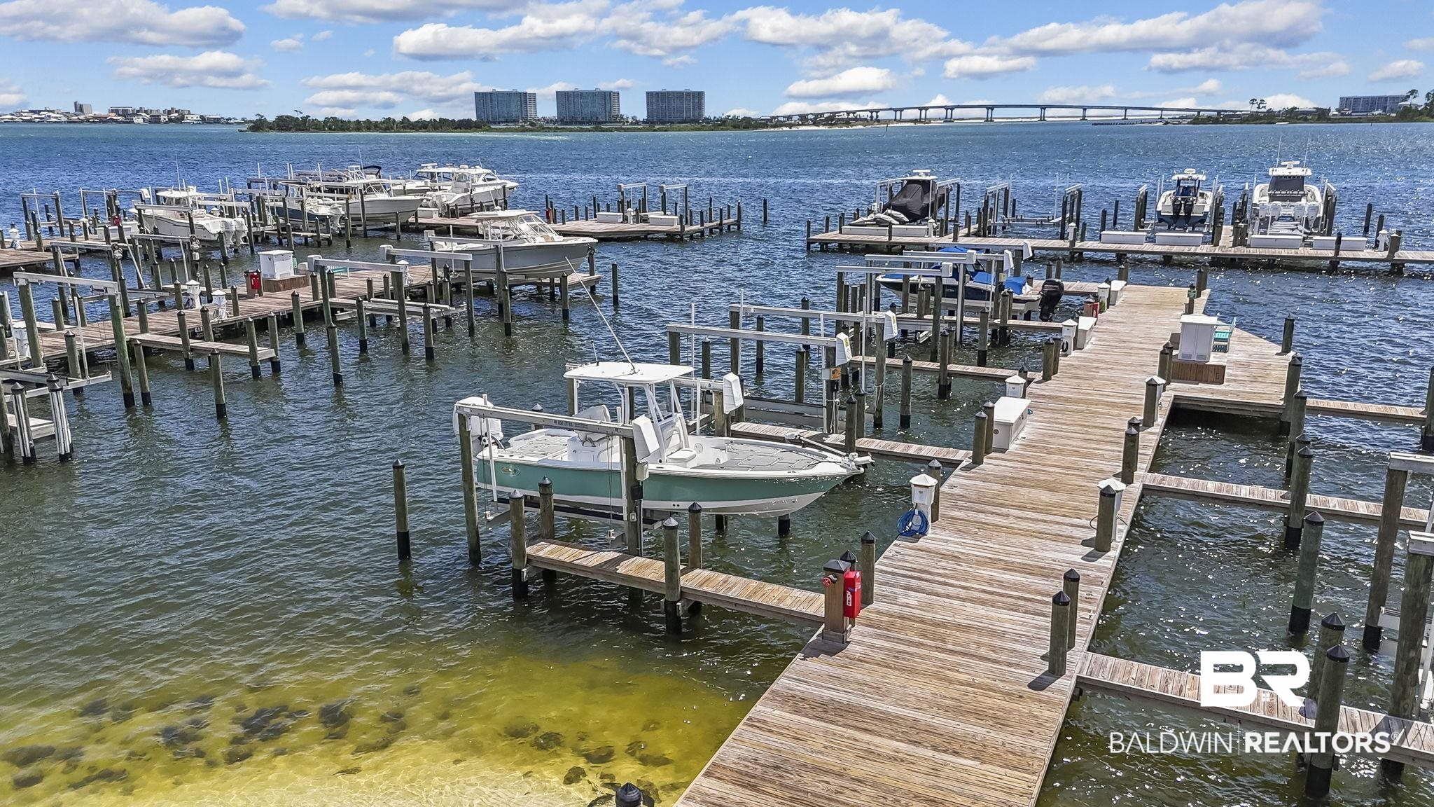 27580 Canal Road, Unit 1526 Orange Beach, AL 36561 - Photo 40 of 49 Dock area with a water view and boat lift