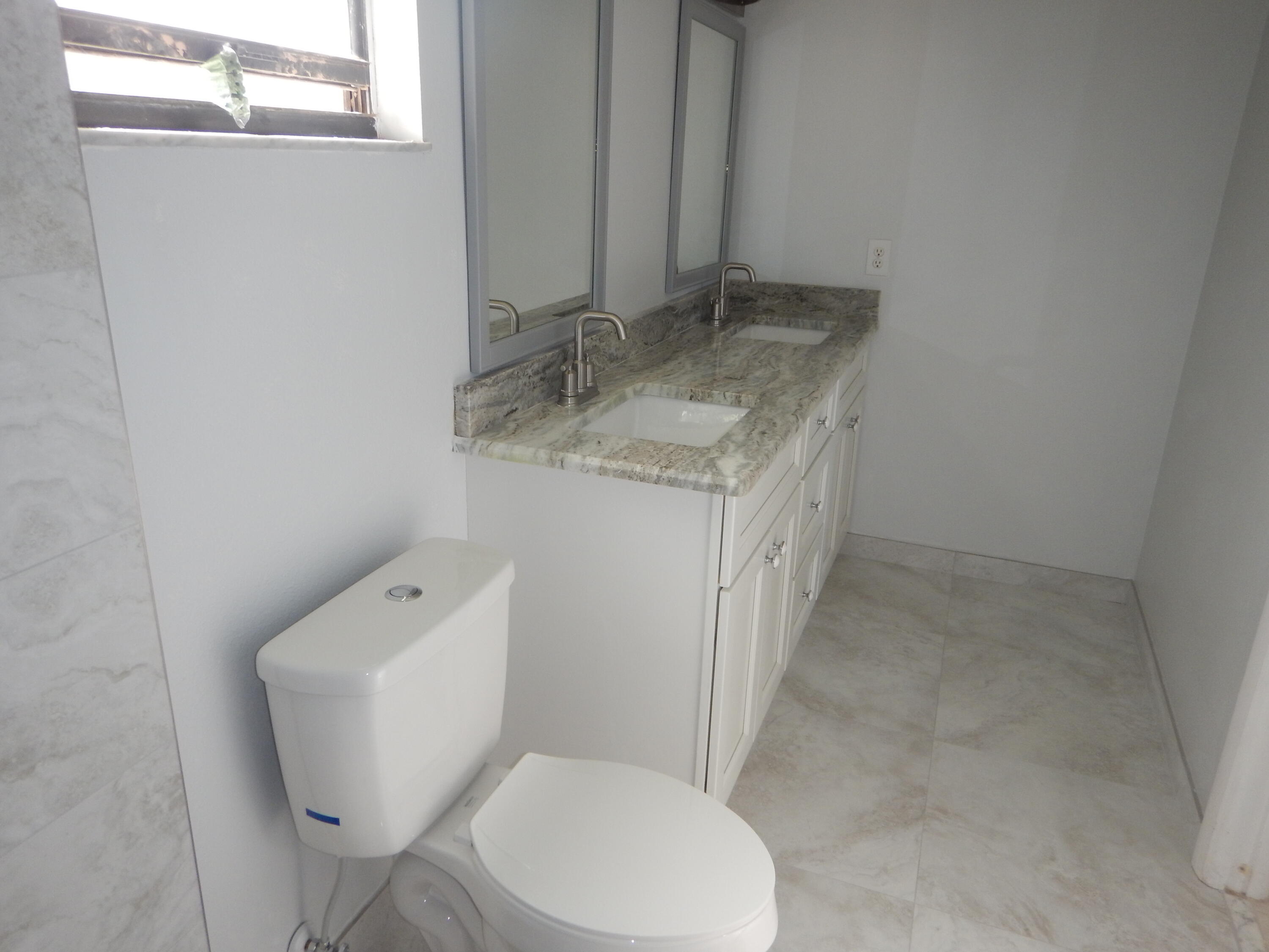 792 Southwest Arkansas Terrace Port St. Lucie, FL 34953 - Photo 3 of 6 Master Bath 2 792 SW Arkansas Terr