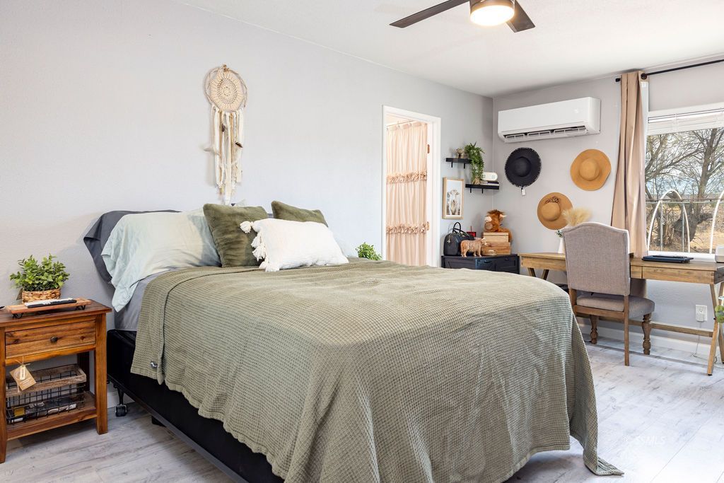 134 South Sierra View Street Ridgecrest, CA 93555 - Photo 23 of 43 a bedroom with bed and a chandelier