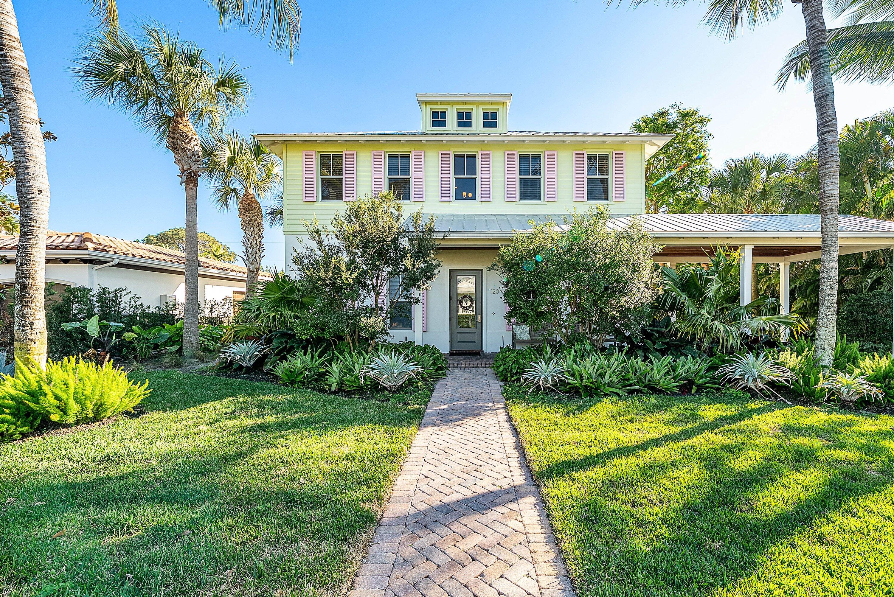120 Grove Way Delray Beach, FL 33444 - Photo 1 of 43 a front view of a house with garden