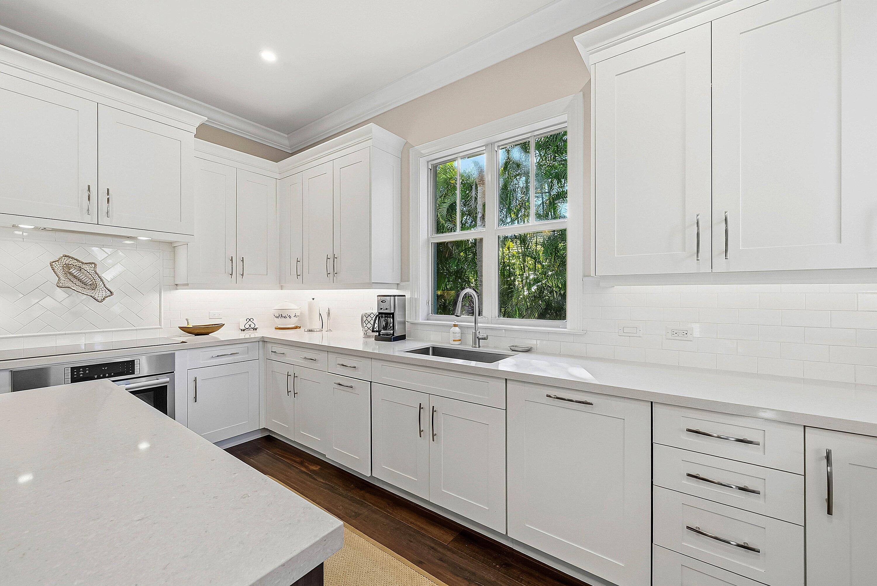 120 Grove Way Delray Beach, FL 33444 - Photo 16 of 43 a kitchen with sink cabinets and window