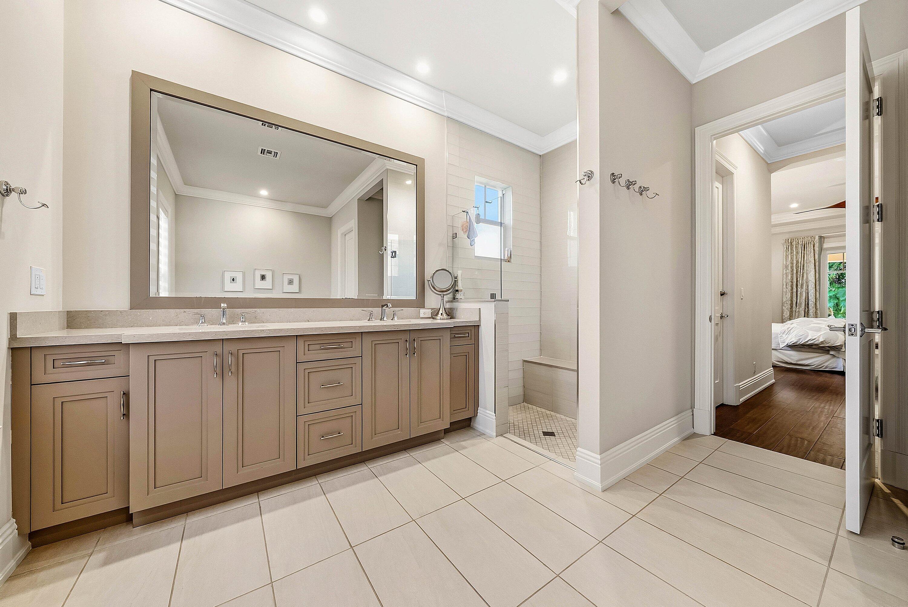 120 Grove Way Delray Beach, FL 33444 - Photo 20 of 43 a spacious bathroom with a granite countertop sink mirror and cabinets