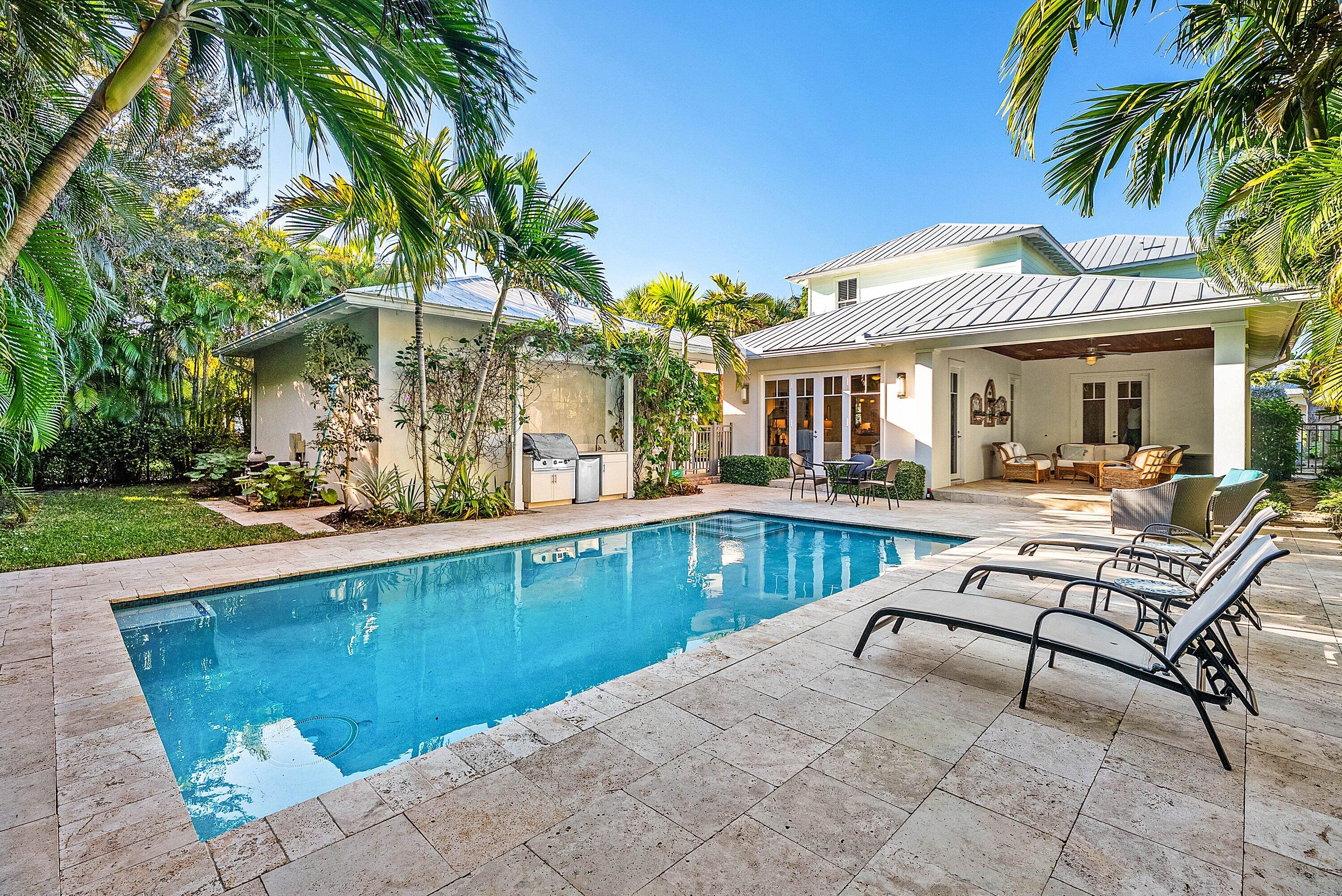 120 Grove Way Delray Beach, FL 33444 - Photo 3 of 43 a view of a house with swimming pool and sitting area