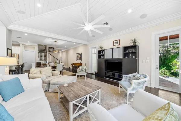a kitchen with stainless steel appliances a dining table and chairs