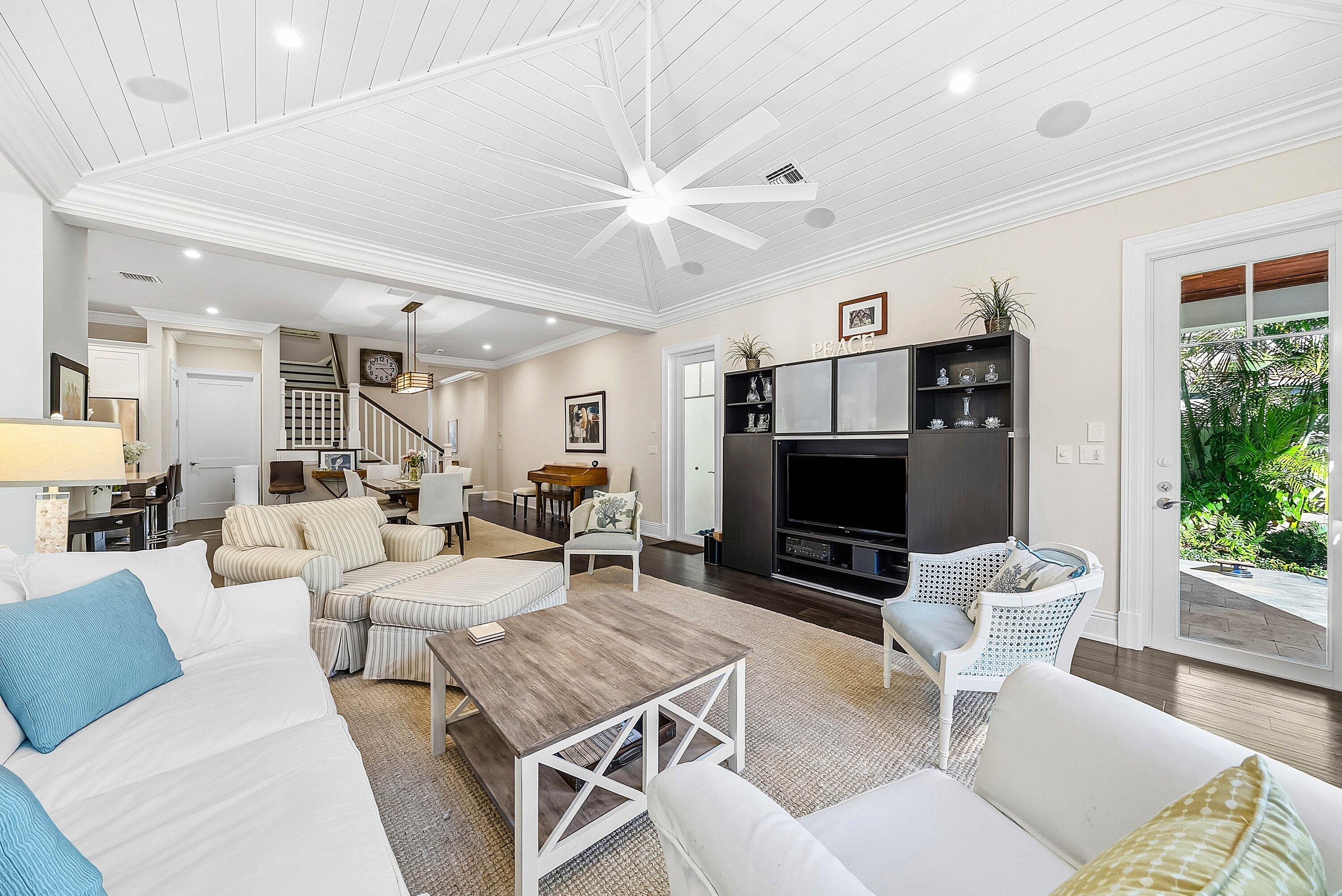 120 Grove Way Delray Beach, FL 33444 - Photo 8 of 43 a living room with furniture a flat screen tv and a fireplace