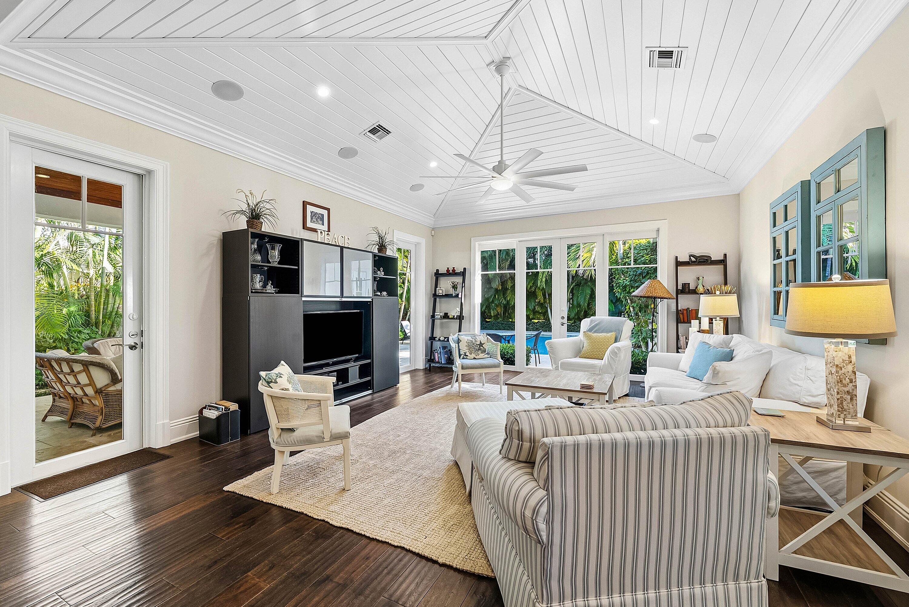 120 Grove Way Delray Beach, FL 33444 - Photo 9 of 43 a living room with furniture a flat screen tv and a large window