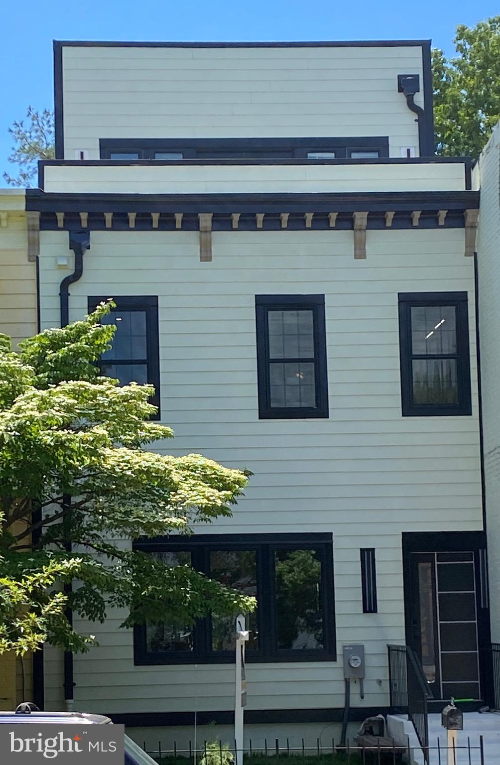 1203 G Street Northeast Washington, DC 20002 - Photo 5 of 63 DECEIVINGLY WIDE ON ALL THREE ABOVE GRADE LEVELS!