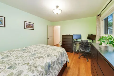 a bedroom with a bed and a table