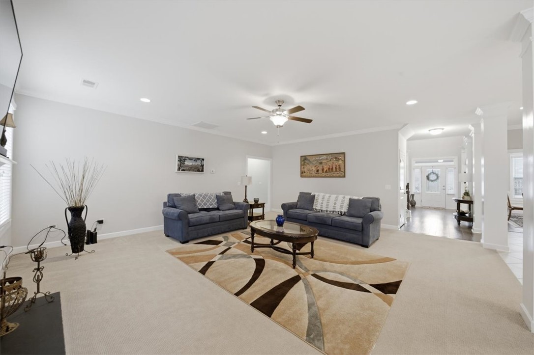 324 Crestgate Way Easley, SC 29642 - Photo 11 of 44 This bright living room offers a comfortable atmosphere with ample space for gatherings.