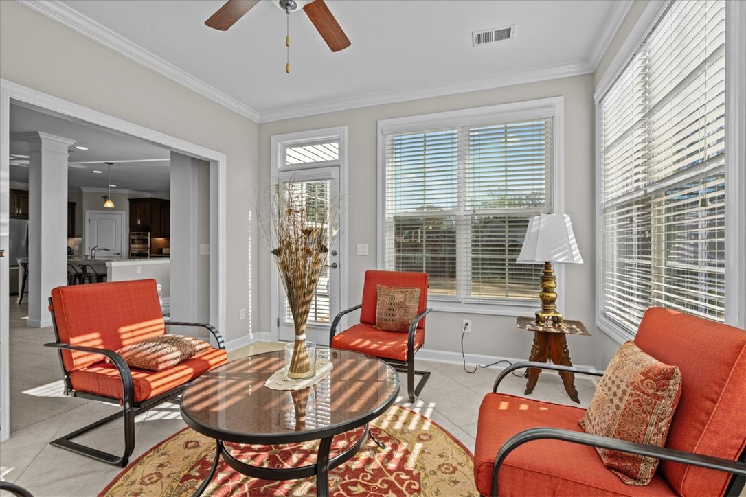 324 Crestgate Way Easley, SC 29642 - Photo 16 of 44 Bright and airy, this inviting sunroom offers a seamless transition between indoors and out.