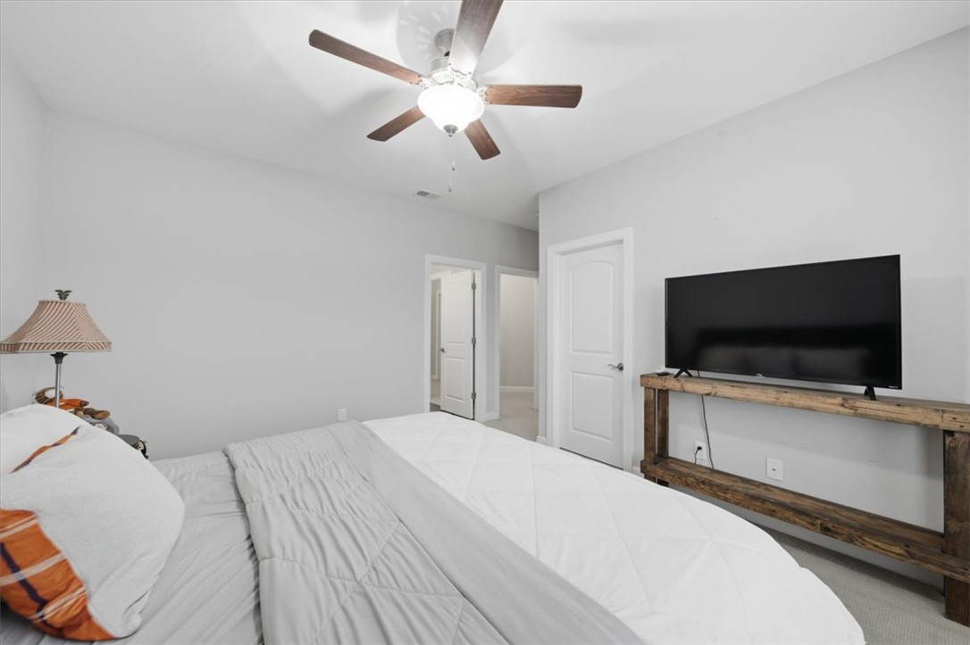 324 Crestgate Way Easley, SC 29642 - Photo 32 of 44 This spacious bedroom offers comfortable living with soft carpeting and ample natural light.