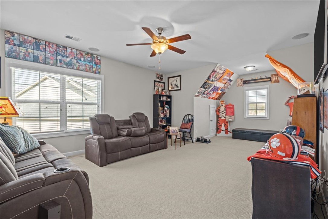 324 Crestgate Way Easley, SC 29642 - Photo 35 of 44 This versatile bonus room features soft carpet and ample natural light, perfect for diverse activities.